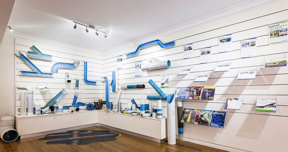 Inside view of Reline-A-pipe showroom with Blueline system on display